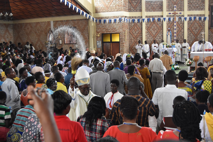 Bishop Célestin Hakizimana blessing the congregation with holy water during the mass of the Solemnity of Our Lady of Sorrows.