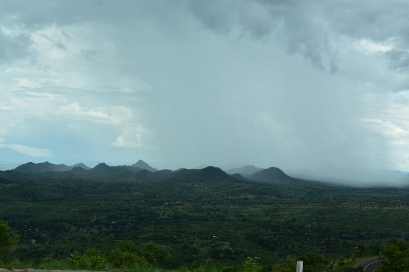 a rain storm over the hills