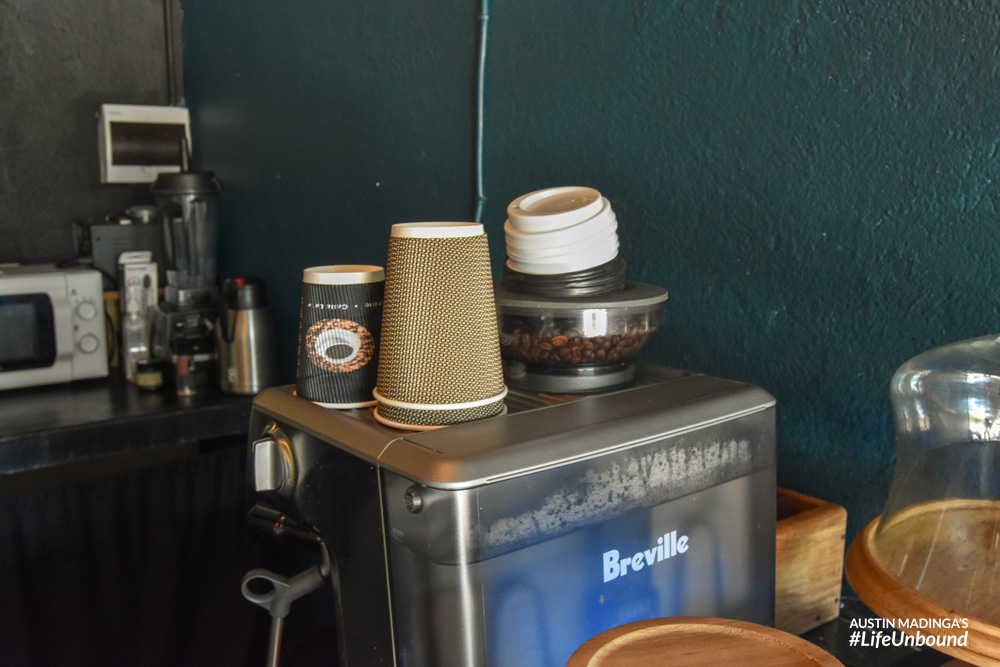 the cups, the beans and the maker